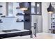Contemporary kitchen with stainless steel appliances and open shelving at 631 Linfield Dr, Durham, NC 27701