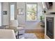Cozy living room with comfortable seating, fireplace, and natural light from the window at 631 Linfield Dr, Durham, NC 27701