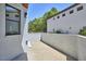 View of the side patio showing the painted white brick at 631 Linfield Dr, Durham, NC 27701