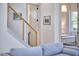 Stylish staircase with stainless steel cable railing that leads up to a bedroom at 631 Linfield Dr, Durham, NC 27701