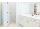 Bathroom with double vanity, white cabinets and bronze hardware with toilet room at 642 The Parks Dr, Pittsboro, NC 27312