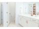 Bright bathroom featuring a modern vanity with copper hardware and a marble-tiled floor at 642 The Parks Dr, Pittsboro, NC 27312