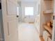 Bright and spacious bathroom featuring modern fixtures, a soaking tub, glass shower, and open shelving for storage at 642 The Parks Dr, Pittsboro, NC 27312