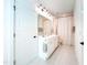 Bathroom with double sink vanity, white cabinets, and shower with curtain at 642 The Parks Dr, Pittsboro, NC 27312