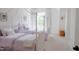This bright bedroom features two twin beds with elegant bedding and an abundance of natural light at 642 The Parks Dr, Pittsboro, NC 27312