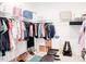 Walk-in closet with ample storage space, organized clothing racks, and shoe displays at 642 The Parks Dr, Pittsboro, NC 27312