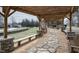 Community walkway featuring stone seating under a pergola, with stone and gravel pathway at 642 The Parks Dr, Pittsboro, NC 27312