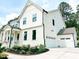 Beautiful two-story home with lush landscaping and a three car garage at 642 The Parks Dr, Pittsboro, NC 27312