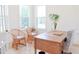 Bright office space featuring wood desk, wicker chairs and natural light from two windows at 642 The Parks Dr, Pittsboro, NC 27312