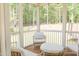 Relaxing screened porch features comfortable seating arrangements and serene views of the surrounding landscape at 642 The Parks Dr, Pittsboro, NC 27312
