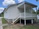 Back porch and stairs of house, providing great place for relaxing and enjoying the outdoors at 703 W Church St, Angier, NC 27501