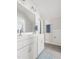 Bright bathroom featuring double vanity, tile flooring and blue accent towels at 706 Great Ridge Pkwy, Chapel Hill, NC 27516