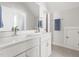 Bathroom with a double vanity, neutral tile floors, and chrome fixtures at 706 Great Ridge Pkwy, Chapel Hill, NC 27516
