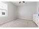 Bedroom with neutral carpet, white walls, a dresser, and large window at 706 Great Ridge Pkwy, Chapel Hill, NC 27516
