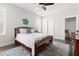 Serene bedroom with a ceiling fan, comfortable bed, and calming decor providing relaxation at 706 Great Ridge Pkwy, Chapel Hill, NC 27516