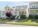 Charming home with landscaped front yard, welcoming front porch, and inviting curb appeal at 706 Great Ridge Pkwy, Chapel Hill, NC 27516