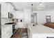 Stylish kitchen with granite countertops, stainless steel appliances, and modern fixtures at 706 Great Ridge Pkwy, Chapel Hill, NC 27516