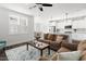 Spacious living room seamlessly connected to kitchen and dining areas, filled with natural light at 706 Great Ridge Pkwy, Chapel Hill, NC 27516