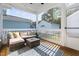 Inviting screened porch with comfortable seating and views of the surrounding landscape at 706 Great Ridge Pkwy, Chapel Hill, NC 27516