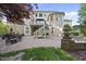 Spacious backyard featuring a paver patio, tiered landscaping, and a multi-level deck at 7312 Hasentree Way, Wake Forest, NC 27587