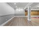 Finished basement featuring neutral walls and hardwood flooring at 7312 Hasentree Way, Wake Forest, NC 27587