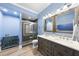 The bathroom features a glass enclosed shower with tile surround and a double vanity at 7312 Hasentree Way, Wake Forest, NC 27587