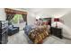 Bedroom features a plush bed with decorative pillows, an armchair, and a side table with a red lamp at 7312 Hasentree Way, Wake Forest, NC 27587