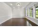 Bright dining room boasts hardwood floors, recessed lighting, and large windows offering natural light at 7312 Hasentree Way, Wake Forest, NC 27587