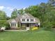Beautiful home with well-maintained lawn and landscaping set among mature trees at 7312 Hasentree Way, Wake Forest, NC 27587