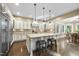 Spacious kitchen features granite countertops, a large island, and ample cabinet space at 7312 Hasentree Way, Wake Forest, NC 27587