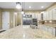 This is a kitchen with stainless steel appliances, granite countertops, and pendant lighting above the sink at 7312 Hasentree Way, Wake Forest, NC 27587