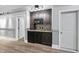 Kitchenette features granite countertops, stainless steel appliances, and custom cabinetry at 7312 Hasentree Way, Wake Forest, NC 27587