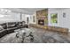 Inviting living room with a stone fireplace and a comfortable seating area at 7312 Hasentree Way, Wake Forest, NC 27587