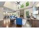 Bright, open living room with a stone fireplace and soaring ceilings at 7312 Hasentree Way, Wake Forest, NC 27587