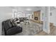 Cozy living room with stone fireplace, plush sofa, and soft carpet at 7312 Hasentree Way, Wake Forest, NC 27587