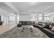 Large living room featuring a sectional sofa, modern lighting, and a carpet at 7312 Hasentree Way, Wake Forest, NC 27587