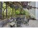 Beautiful outdoor patio area with a stone fire pit and seating, perfect for entertaining at 7312 Hasentree Way, Wake Forest, NC 27587