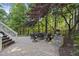 Backyard patio includes a gas fire pit with seating for outdoor entertaining at 7312 Hasentree Way, Wake Forest, NC 27587