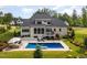 Aerial view showcases the backyard oasis with a pool, patio, and beautifully landscaped surroundings at 8017 Discovery Falls Trl, Wake Forest, NC 27587