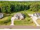 Aerial view displays the home's well-manicured lawn and mature trees surrounding the property at 8017 Discovery Falls Trl, Wake Forest, NC 27587