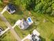 Expansive backyard features a swimming pool, patio, and beautifully landscaped grounds for relaxing and entertaining at 8017 Discovery Falls Trl, Wake Forest, NC 27587