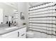Bathroom with a vanity, a large mirror, and a shower with curtain at 8017 Discovery Falls Trl, Wake Forest, NC 27587