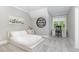 Bedroom has a desk, modern light fixture and neutral colors at 8017 Discovery Falls Trl, Wake Forest, NC 27587