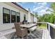 Deck features outdoor dining set with umbrella at 8017 Discovery Falls Trl, Wake Forest, NC 27587