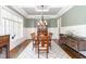 Elegant dining room with classic decor, hardwood floors, and ample natural light at 8017 Discovery Falls Trl, Wake Forest, NC 27587