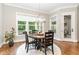 A charming dining area with large windows offers abundant light and a view of the outdoors at 8017 Discovery Falls Trl, Wake Forest, NC 27587