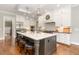 Spacious kitchen with modern appliances, a large island, and stylish pendant lighting at 8017 Discovery Falls Trl, Wake Forest, NC 27587