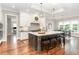 Spacious kitchen with modern appliances, a large island, and stylish pendant lighting at 8017 Discovery Falls Trl, Wake Forest, NC 27587