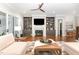 The spacious living room showcases custom built-ins, a fireplace, and ample natural light at 8017 Discovery Falls Trl, Wake Forest, NC 27587
