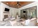 The inviting outdoor patio provides comfortable seating, a fireplace, and access to the home's interior at 8017 Discovery Falls Trl, Wake Forest, NC 27587